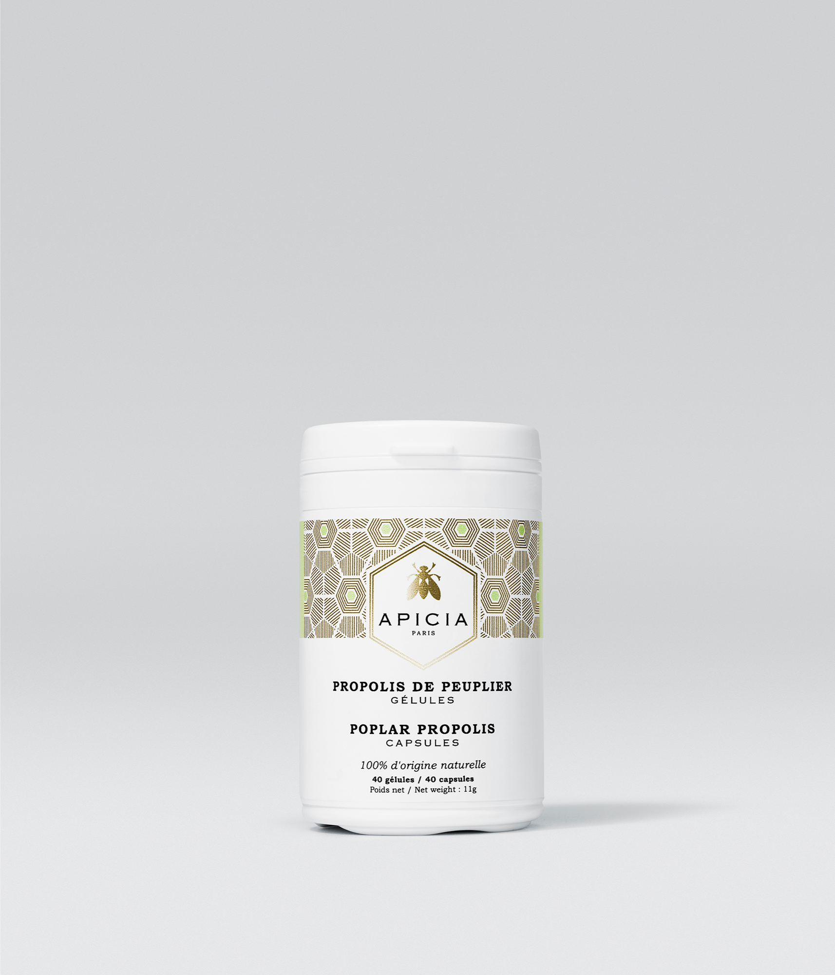 Packshot d’un flacon blanc contenant des gélules de propolis, avec un bouchon blanc vissé sur le dessus, sur fond gris.