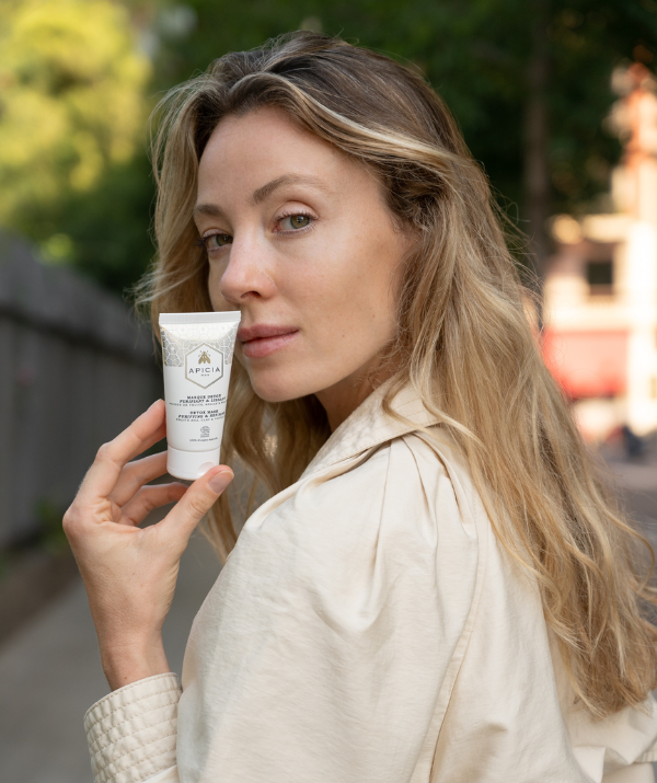 girl holding a white tube